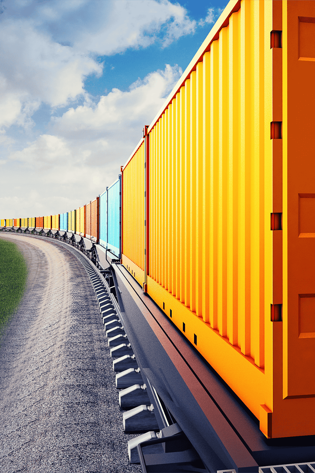 Tren de carga ferroviario transportando contenedores multicolores en una curva bajo cielo despejado.